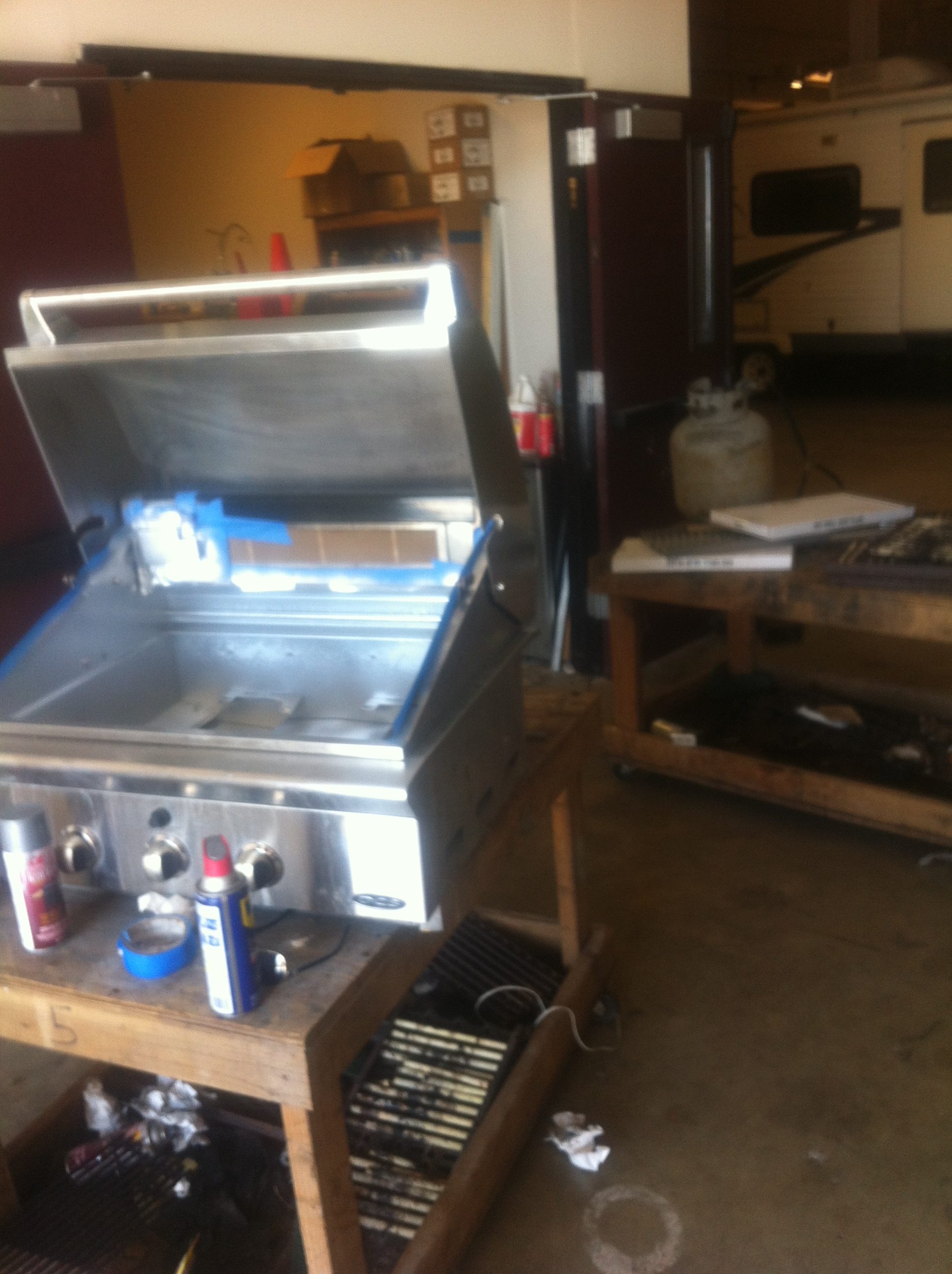 Image of BBQ being rebuilt in shop